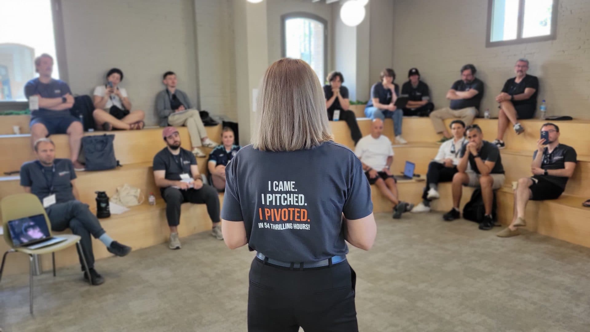 A founder presents to a seated audience during the June 2026 edition in València.